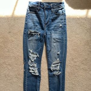 Blue American Eagle next level stretch ripped jeans. Size 0